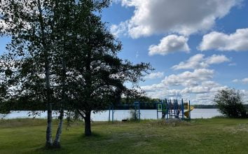 View Of Lake And Playground Equipment